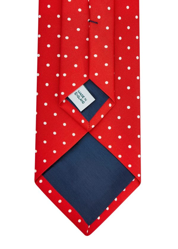 Roderick Charles red silk tie with white spots.