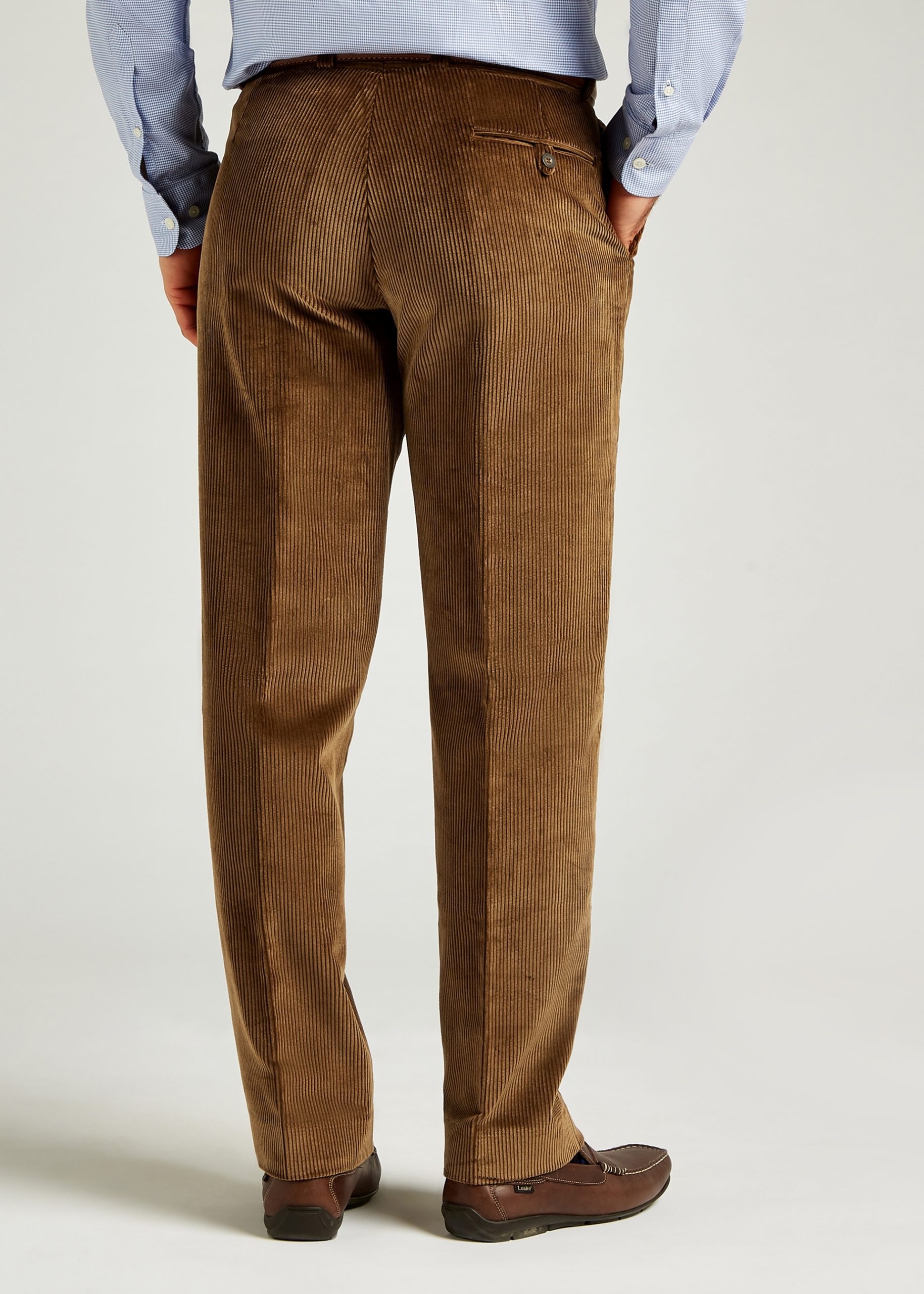 Tan corduroy trousers styled with blue shirt and brown leather belt