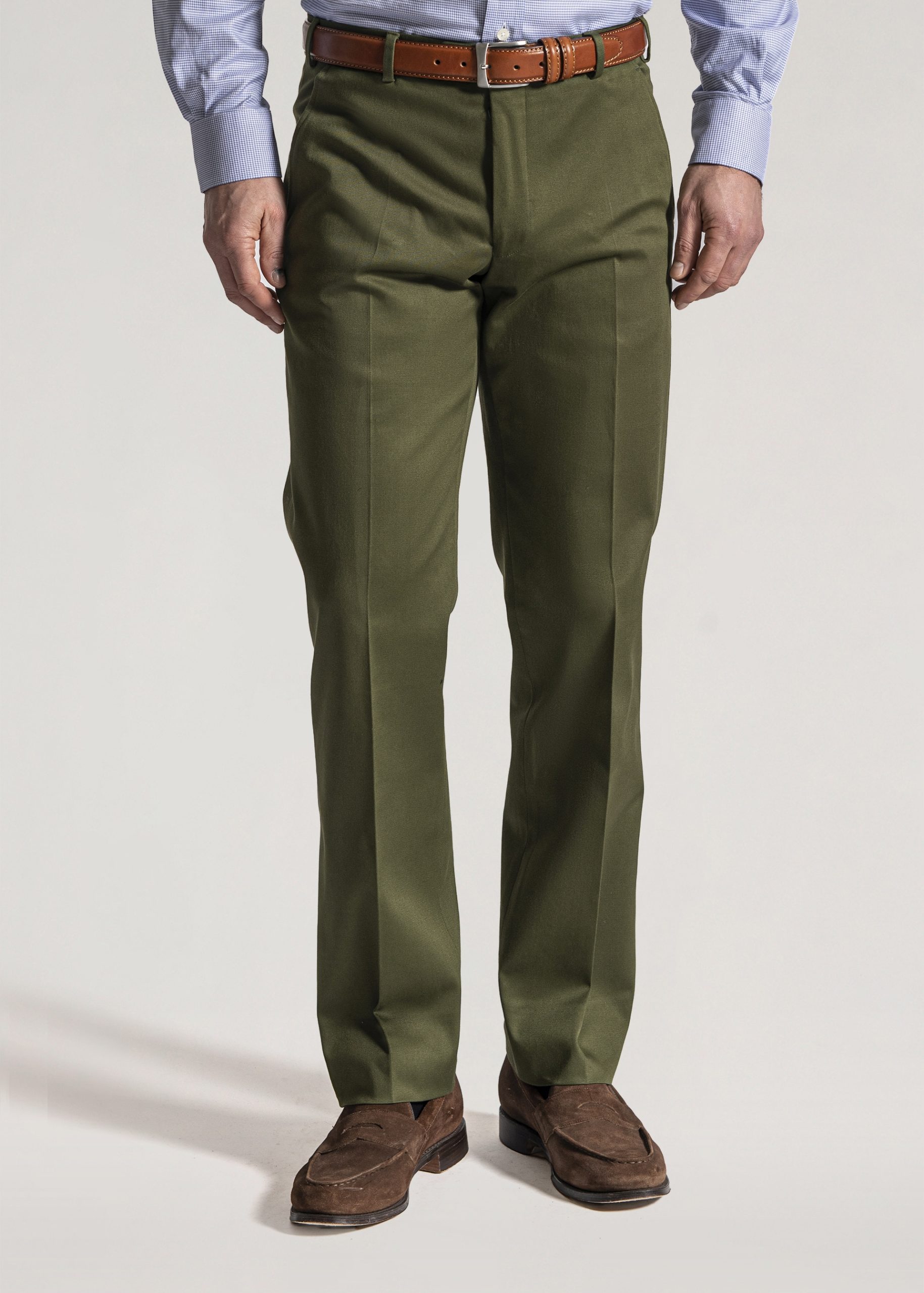 Army green cotton twill trousers styled with brown leather belt