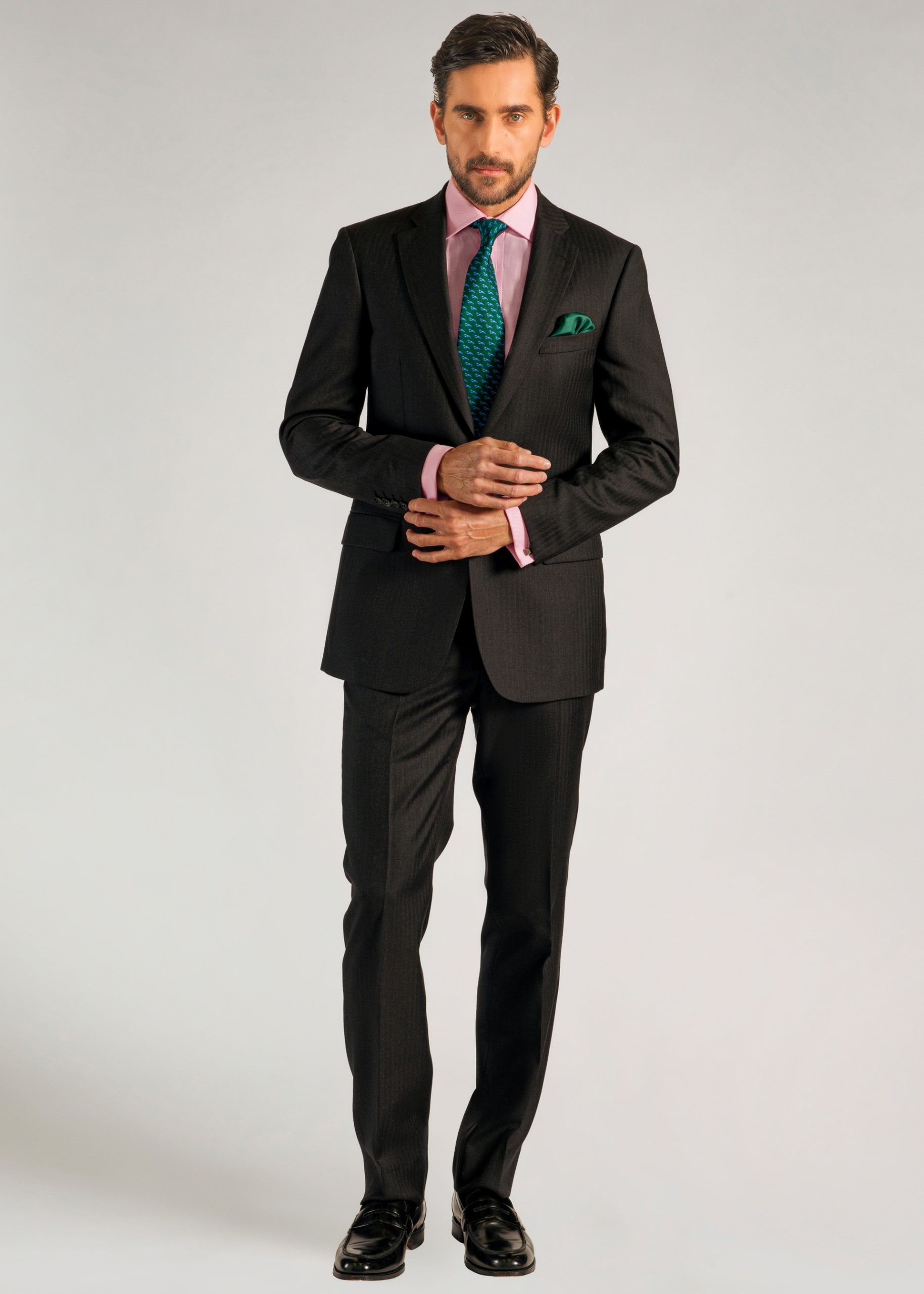 Roderick Charles grey herringbone suit styled with pink shirt and green tie
