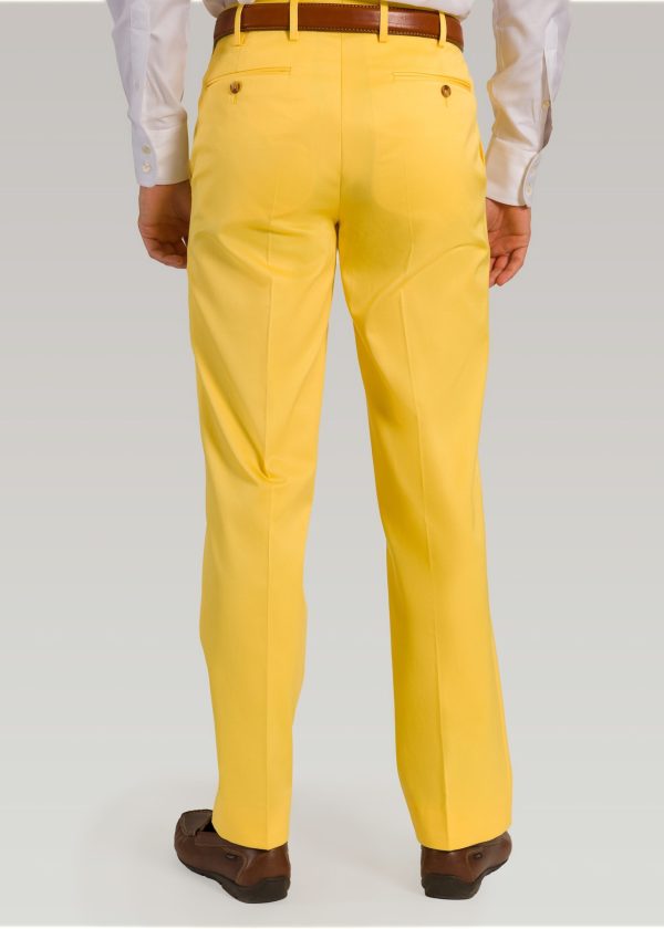 Lemon coloured men's cotton trousers styled with brown leather belt