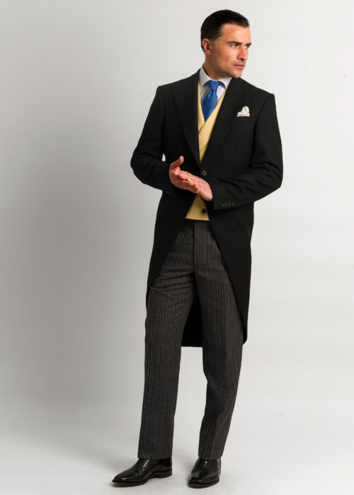 A formal morning suit outfit styled with a yellow formal waistcoat.