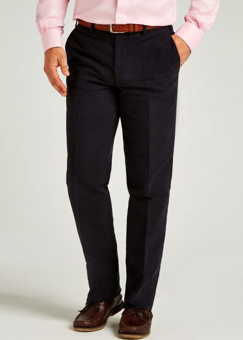 Navy moleskin trousers styled with leather belt