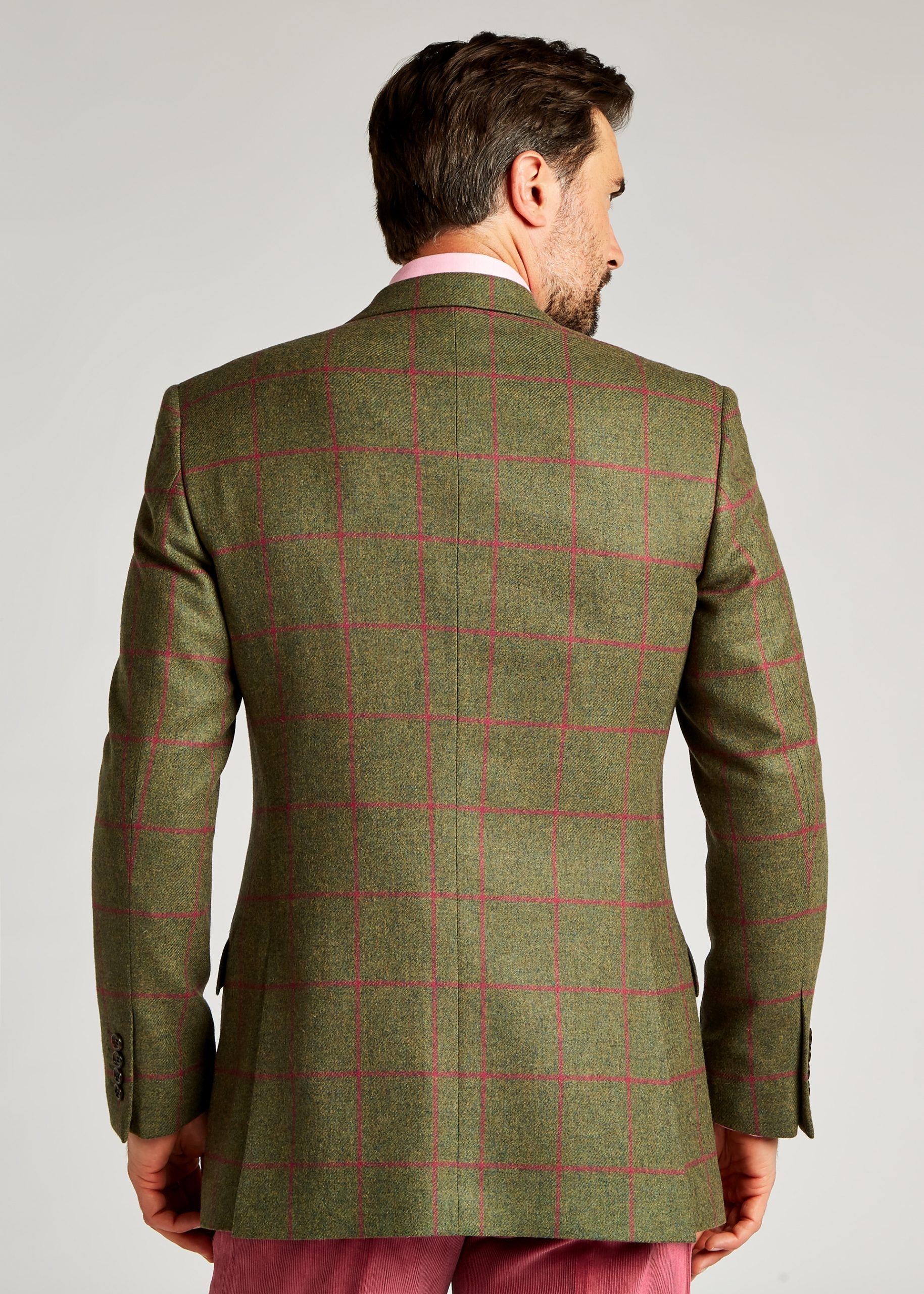 Men’s tailored fit tweed jacket in green and pink styled with pink trousers