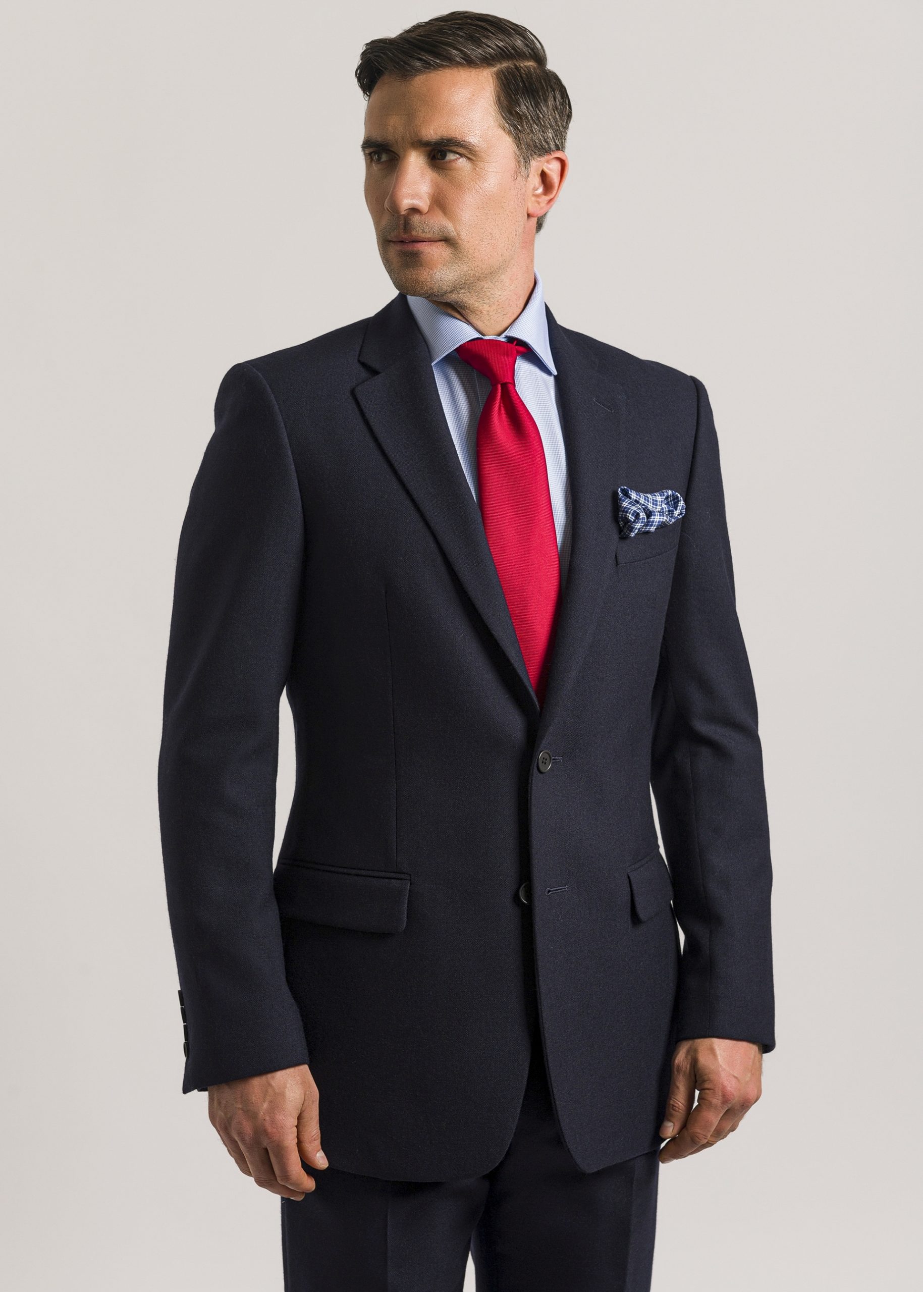Men’s tailored fit navy suit styled with blue shirt