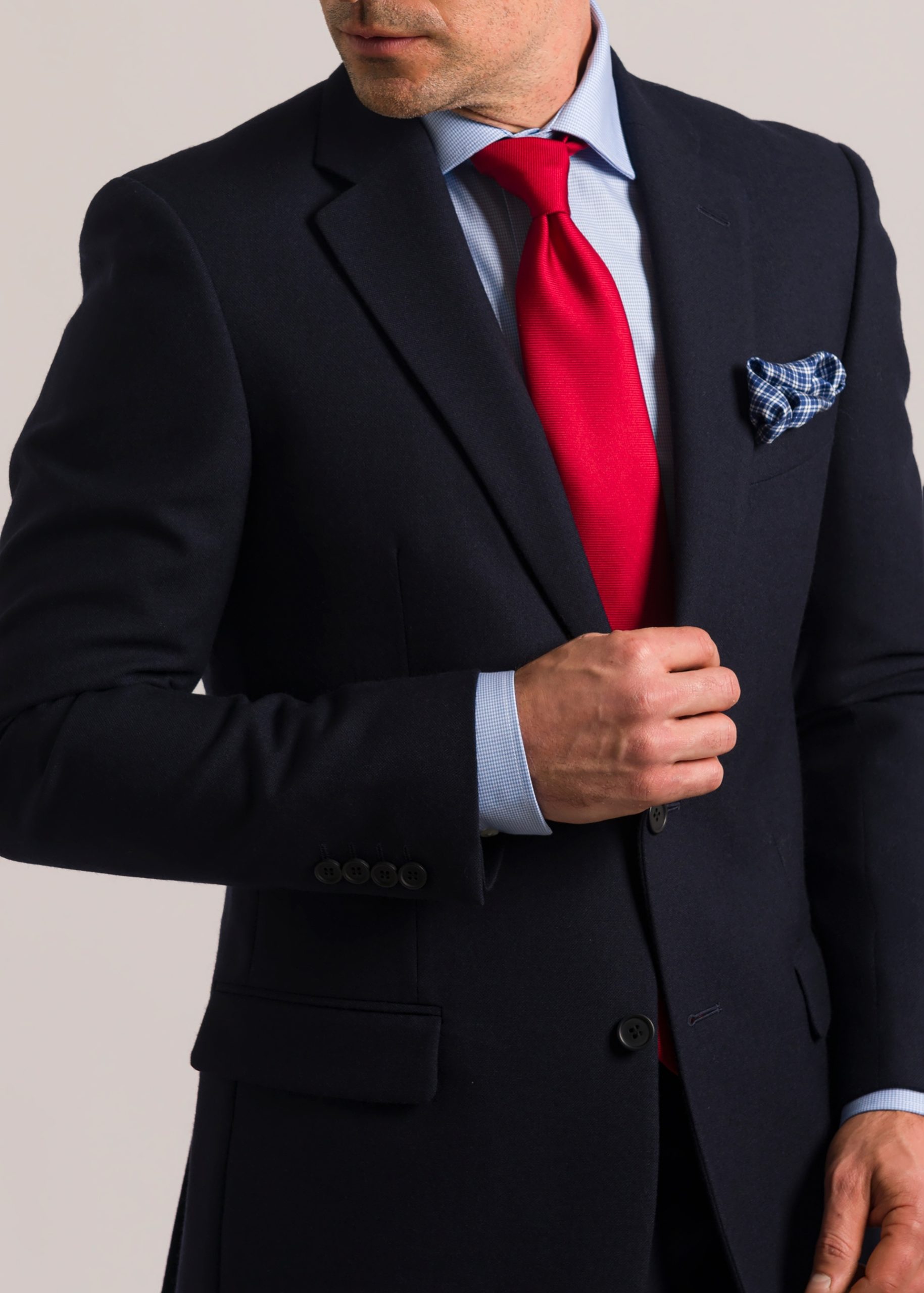Men’s tailored fit hopsack navy suit styled with red tie