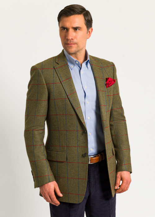 Green, blue and red windowpane tweed jacket styled with open neck shirt.