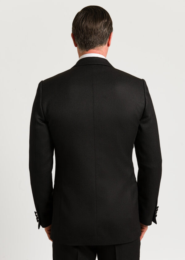 The black of the black men's dinner suit jacket.