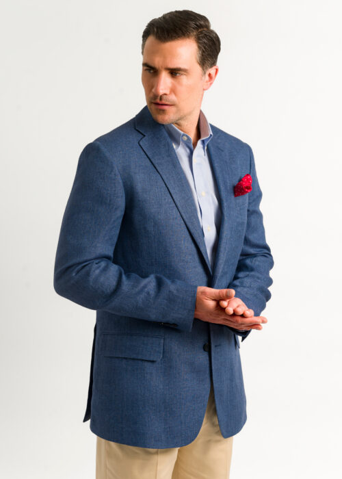 Smart men's blue tailored fit linen jacket styled with cream chinos.