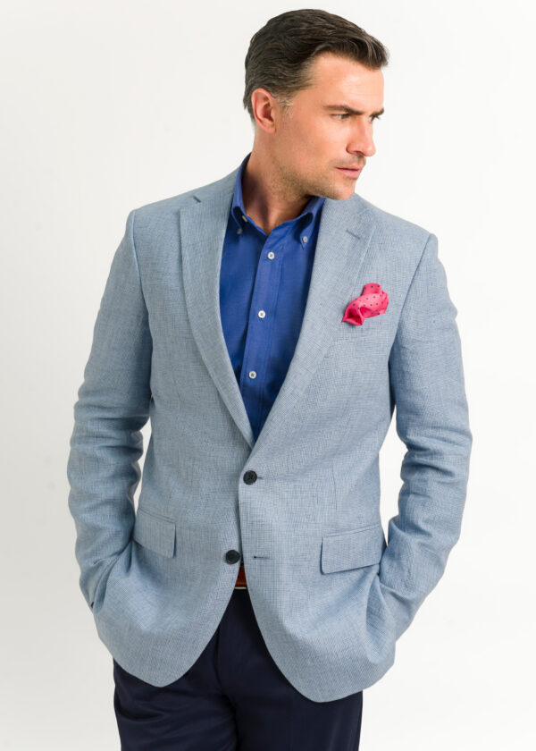 A tailored fit light blue linen jacket, style with open neck shirt in dark blue for a more casual look.