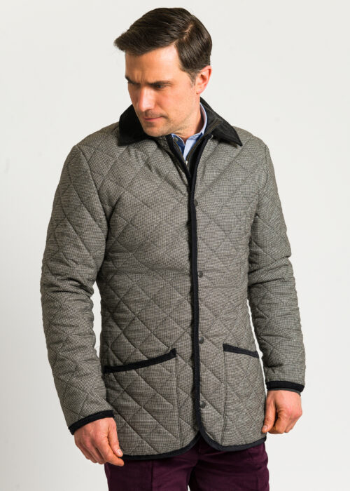 Light grey wool quilted jacket with press stud fastening.