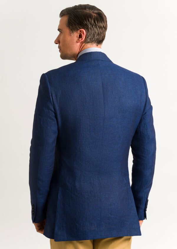 The back of a men's tailored fit smart dark blue linen jacket.