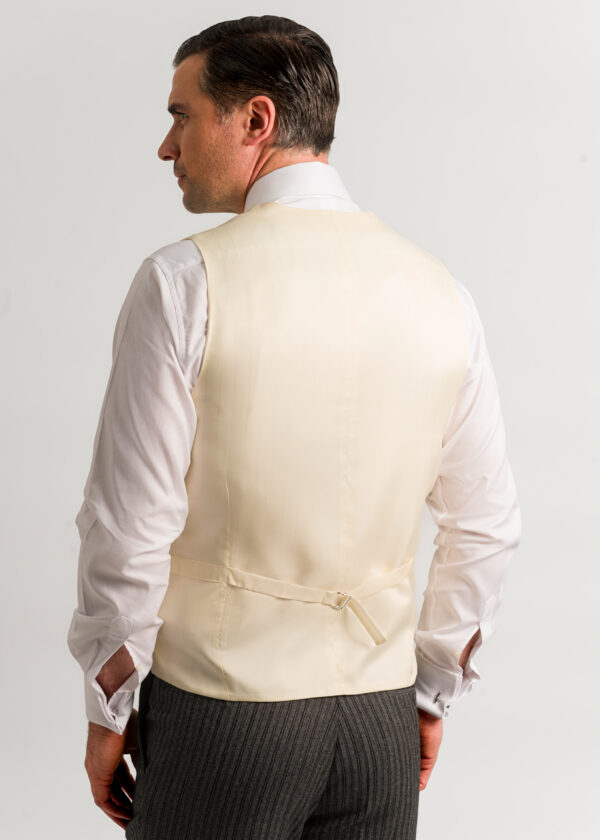 The back of a men's formal waistcoat that completes a morning suit outfit, perfect for a wedding or races.