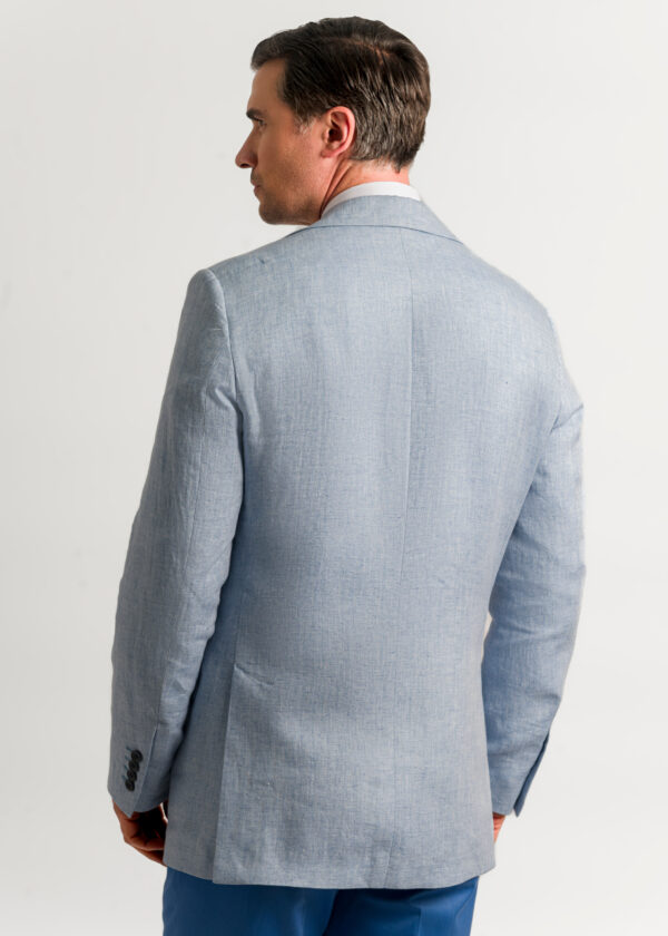 The back of a man's pale blue linen jacket.