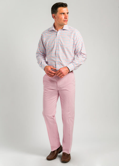 A pair of men's pink lightweight cotton chinos with flat front.