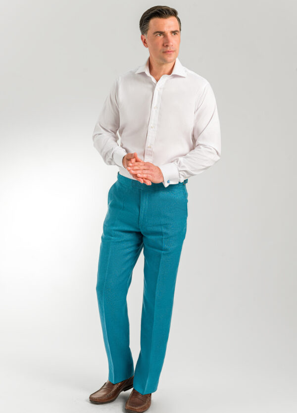 A men's smart linen trouser in a beautiful teal.