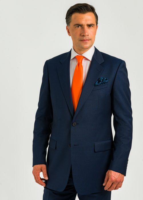 Roderick Charles dark blue classic fit suit with orange tie