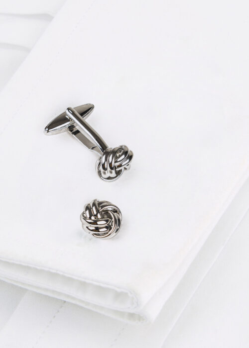 A Roderick Charles silver nickel knot design cufflink