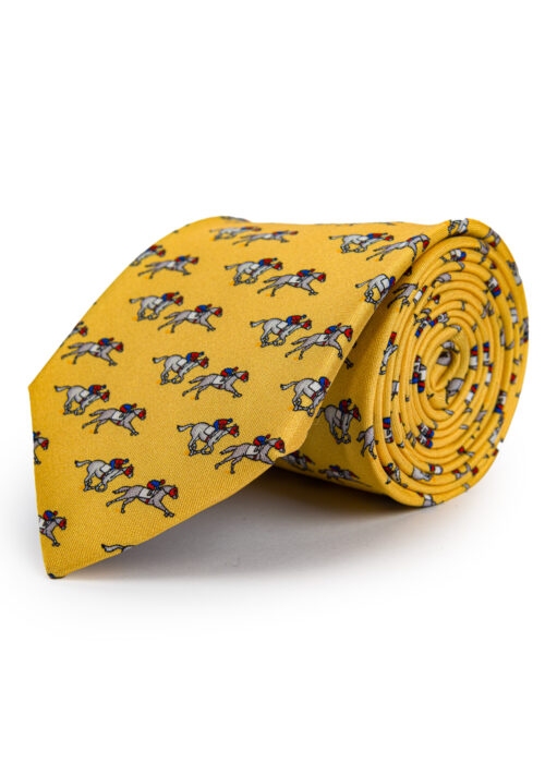 A rolled up Roderick Charles yellow silk tie depicting horse racing horses and jockeys