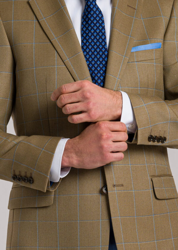 A tailored fit Roderick Charles tan wool jacket with a dual-tone blue windowpane check