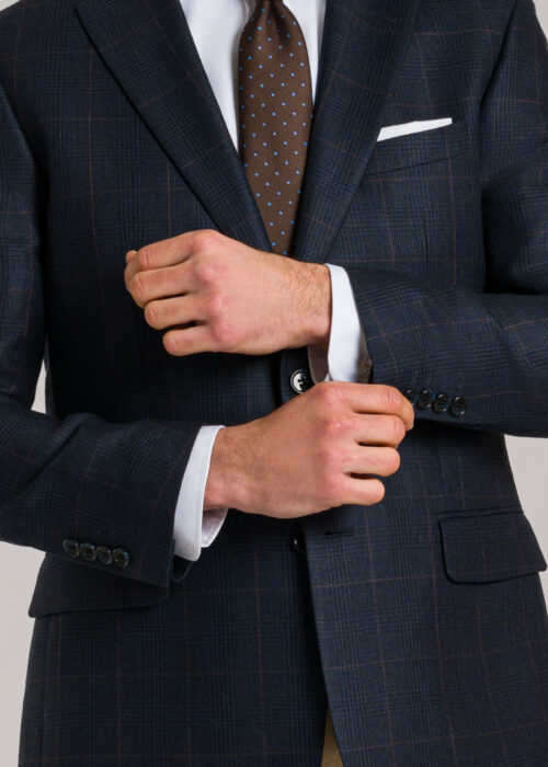 A tailored fit Roderick Charles navy glen check jacket with a rust windowpane check