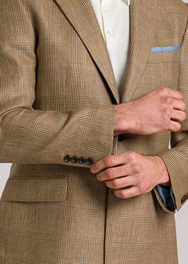 A tailored fit Roderick Charles brown glen check jacket with a green and blue windowpane check